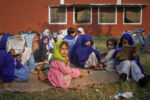 Girls attend a lesson outside a damaged classroom at Government Girls Primary School No. 3, which was bombed on Sunday by suspected militants, in Swabi, located in Pakistan's Khyber Pakhtunkhwa province November 15, 2011. Pakistan's Taliban movement, which is close to al Qaeda, has bombed hundreds of schools since launching a campaign to topple the U.S.-backed government in 2007. Like Taliban militants in neighbouring Afghanistan, the Pakistani Taliban want girls barred from education. Picture taken November 15, 2011. To match Feature PAKISTAN-TALIBAN/SCHOOLS REUTERS/Faisal Mahmood (PAKISTAN - Tags: POLITICS CIVIL UNREST EDUCATION) - RTR2U2ZT