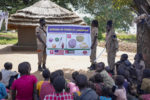 Staff from the Mines Advisory Group (MAG) teach children about the risks of unexploded mines, in Moli village, Eastern Equatoria state, in South Sudan Friday, May 12, 2023. As South Sudanese trickle back into the country after a peace deal was signed in 2018 to end a five-year civil war, many are returning to areas riddled with mines left from decades of conflict. (AP Photo/Sam Mednick)